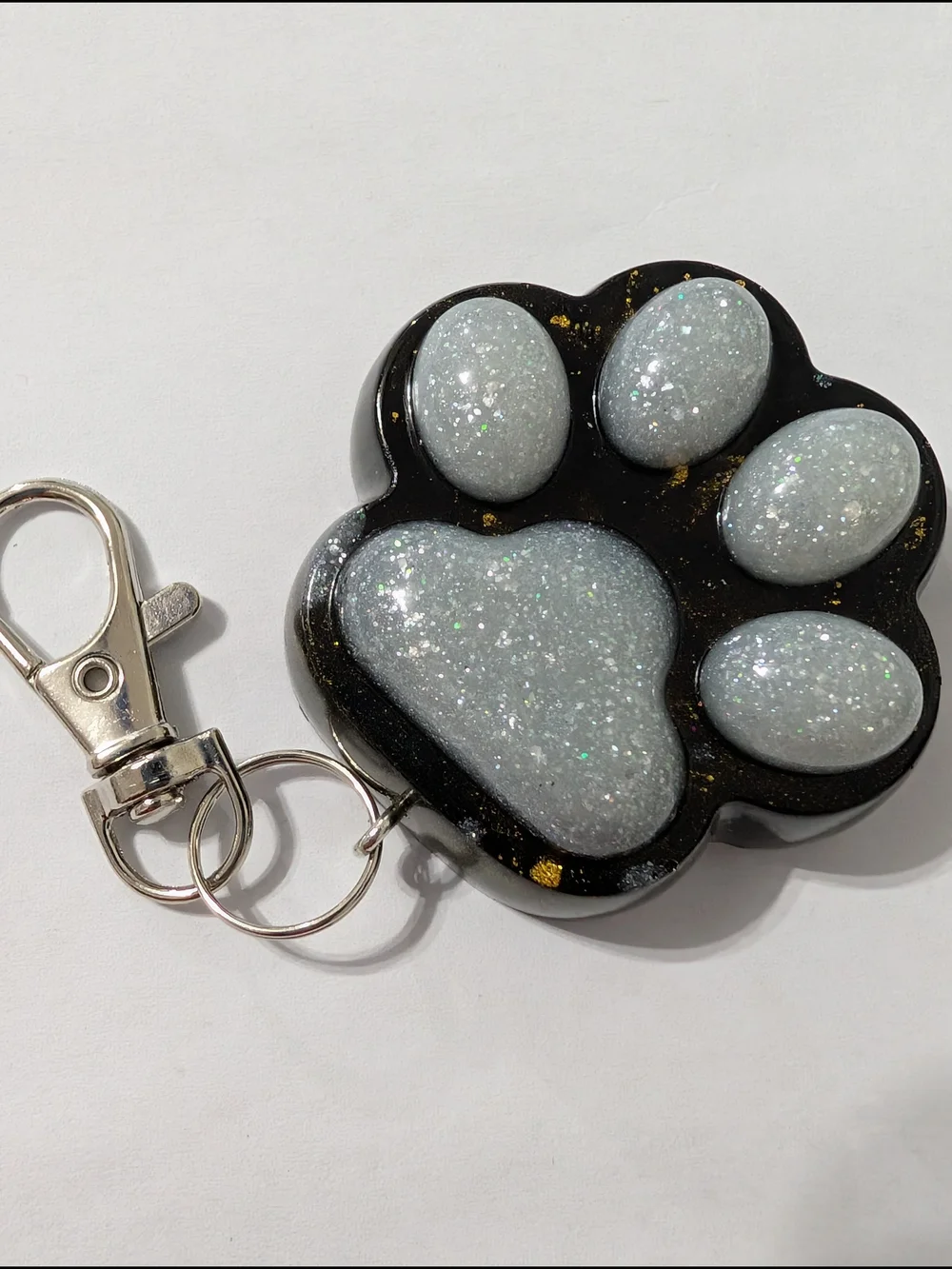 Sparkling White Paw Keychain with a picture of a kitten on the back. Handmade.